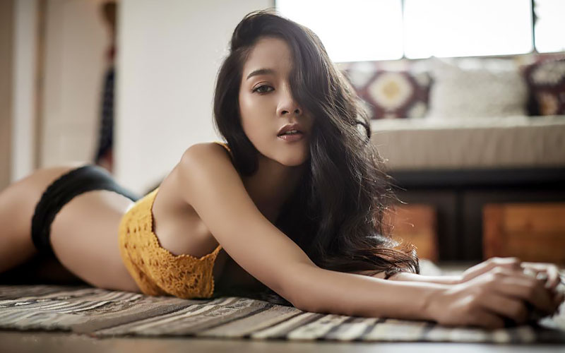 pretty asian woman on floor